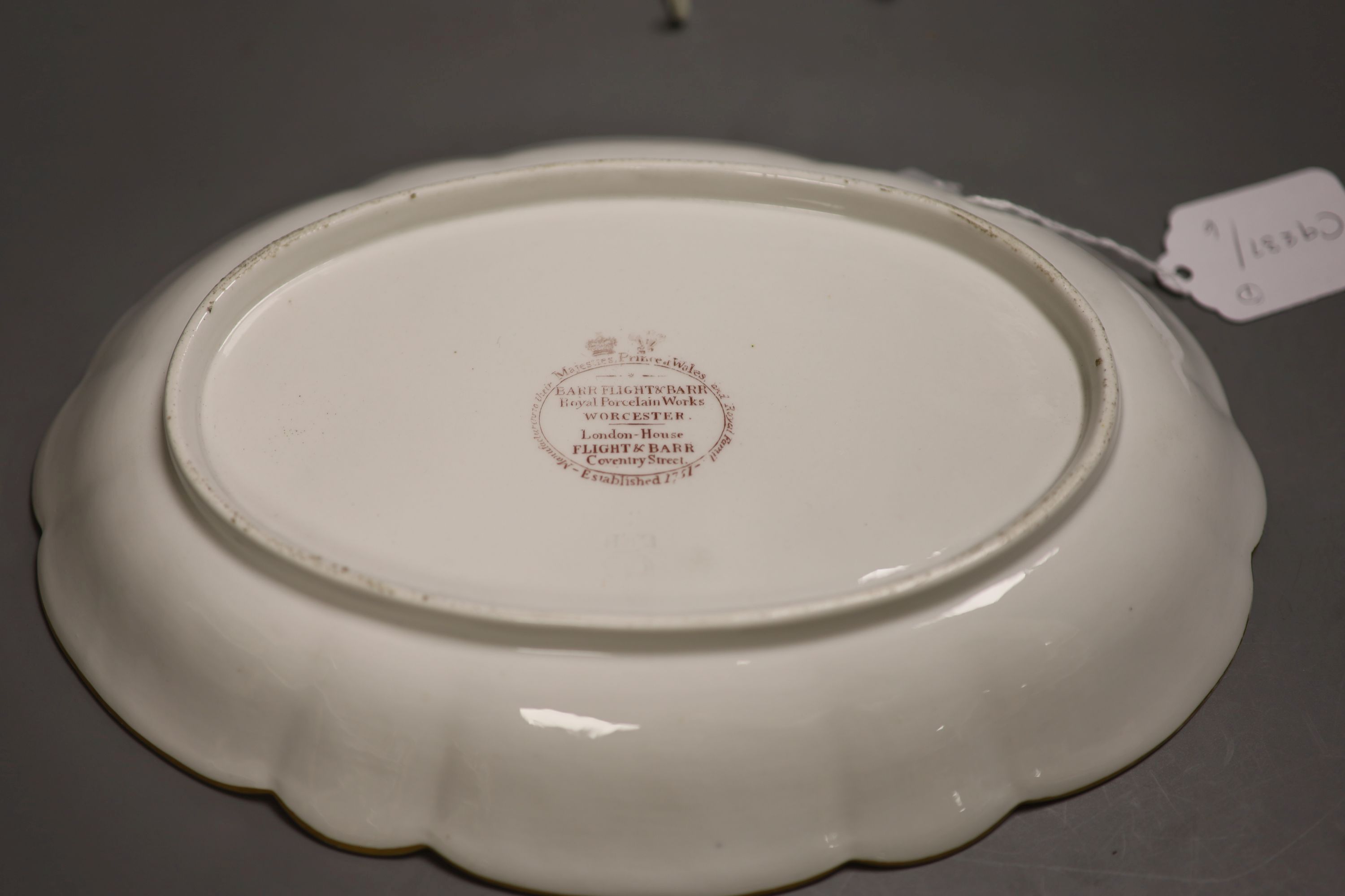 A Barr Flight and Barr pink ground oval dish with elaborate gilding and a family crest of a stag, Royal Warrant mark, c.1810, length 29